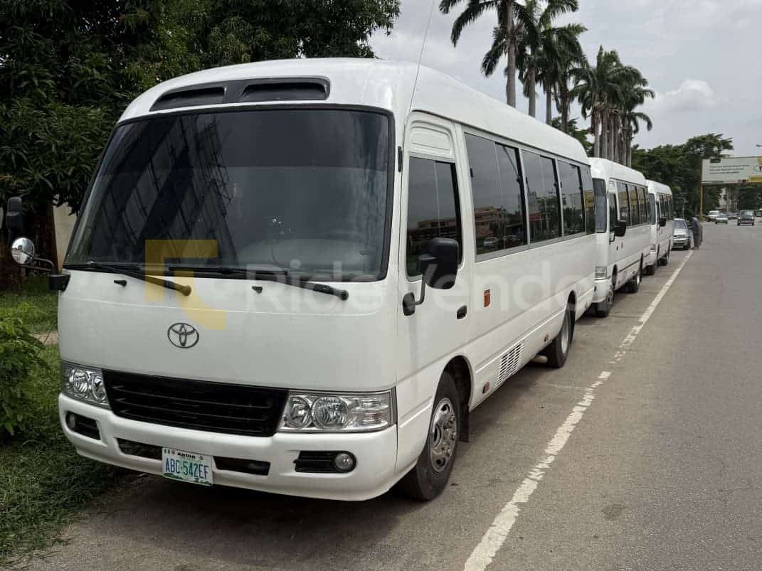 2018 Toyota Coaster Bus available for chauffeur-driven car hire in Nigeria