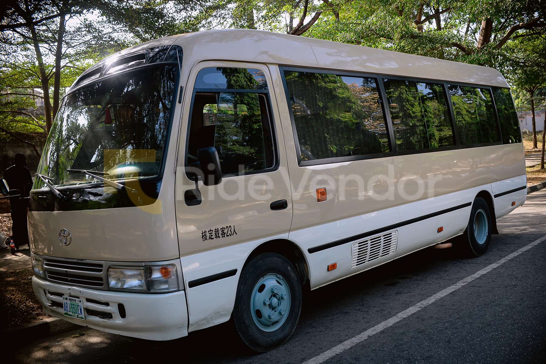 2016 Toyota Coaster Bus available for chauffeur-driven car hire in Nigeria