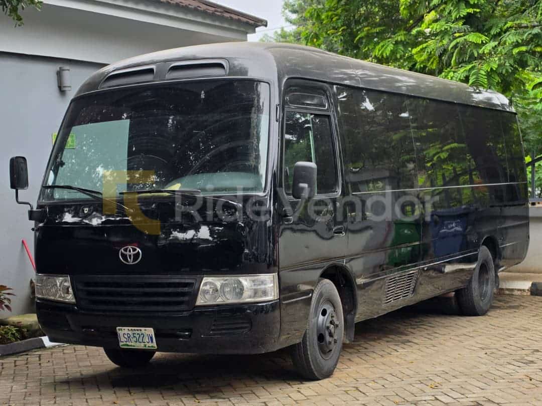 Toyota Coaster Bus available for chauffeur-driven car hire in Nigeria